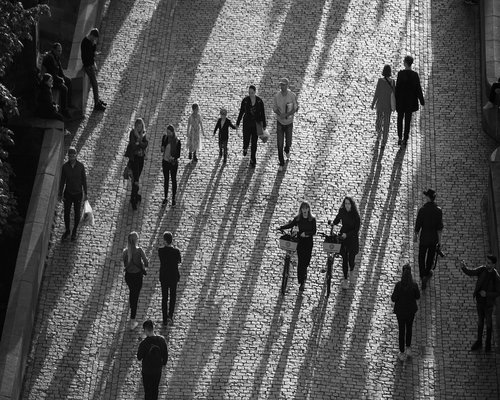 People walking calmly near a TransMilenio station in Bogota
